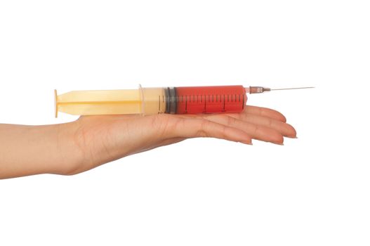 Woman holds in the hand syringe with a new antibiotic mixed with blood