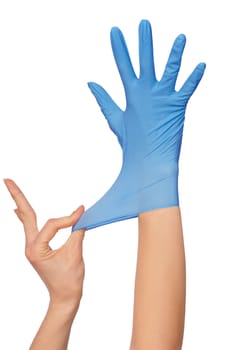 doctor putting on blue sterilized medical glove for making operation