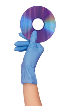 Disk with dangerous confidential audio and video about hacker programs and viruses in a hand of the inspector