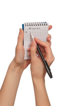 business woman writes mission for business plan