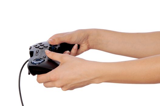 The girl plays a computer game with the help joypad