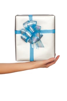 woman giving a silver box with blue bow as a gift