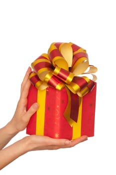woman giving a red box with yellow bow as a gift