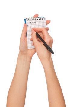 business woman writes mission for business plan