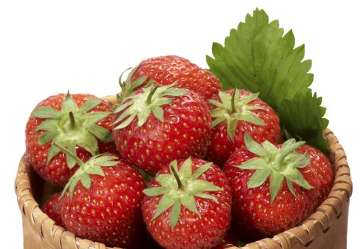 Strawberry in bark basket on white background