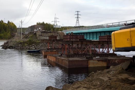 Construction of the bridge using a craft. Russia. Kola Peninsula