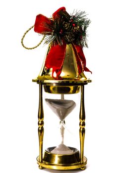 Christmas bell on hourglass isolated on white background.  Concept showing time running out for Christmas shopping.