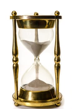 Gold hourglass isolated on white background.