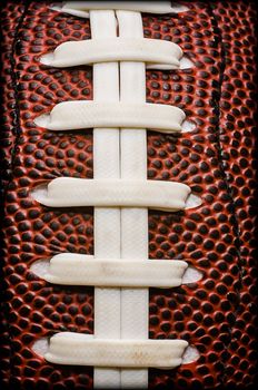 Closeup of laces on American football.