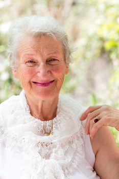 Grandmother still looking at you positively with her white hair and complimenting nice clothing.