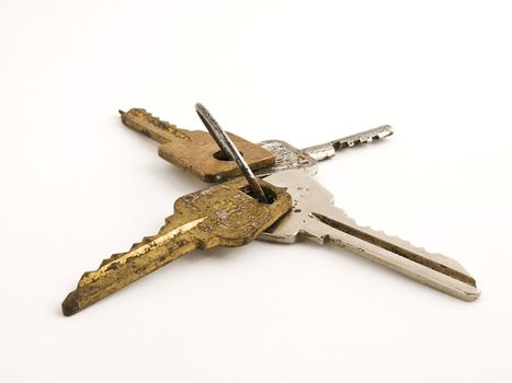 Old rusty keys isolated on white background. Close-up