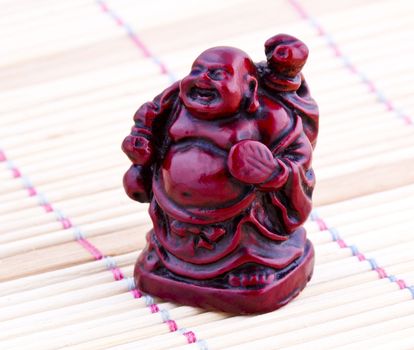 Netsuke red figure. Vintage statue.  Close up