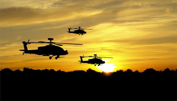 Flying helicopter silhouettes on sunset background