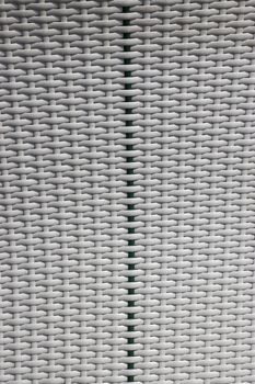 Vertical texture of braided wicker white and green 
