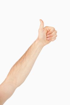Side view of left arm giving thumbs up against a white background