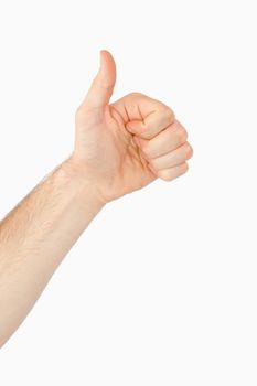 Side view of left hand giving thumb up against a white background