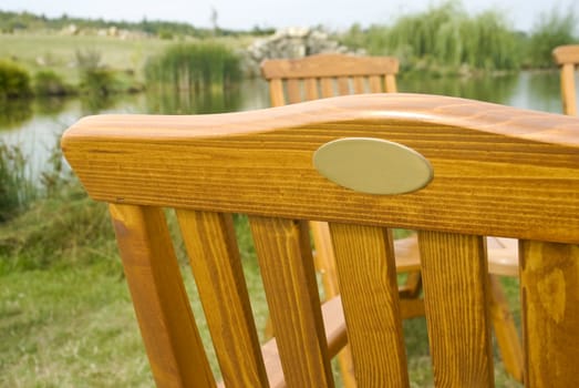 A wooden garden chair seat in a detail