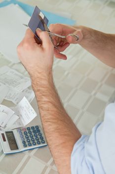 Credit card being destroyed by scissor