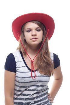 A girl in a red straw hat, studio shot