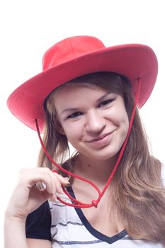 A girl in a red straw hat, studio shot