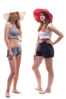 Two girls in summer hats studio photography