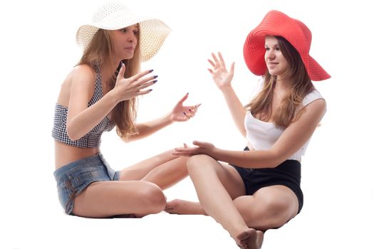 Two girls in summer hats studio photography