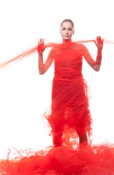 Beautiful girl in a red cloth studio shooting