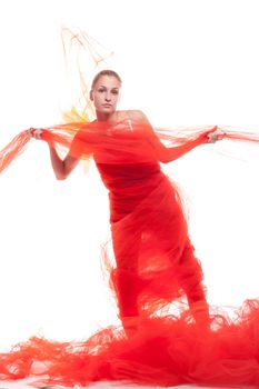 Beautiful girl in a red cloth studio shooting