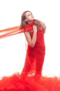 Beautiful girl in a red cloth studio shooting