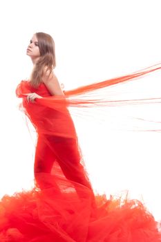 Beautiful girl in a red cloth studio shooting