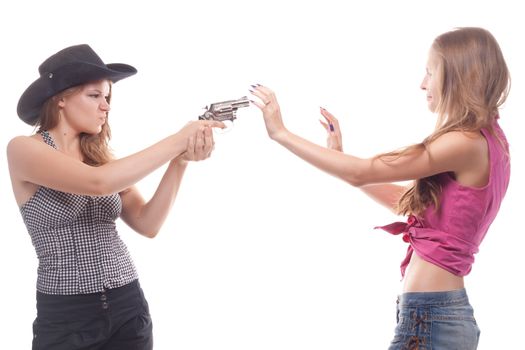 Portrait of two young girls with a gun shooting studio