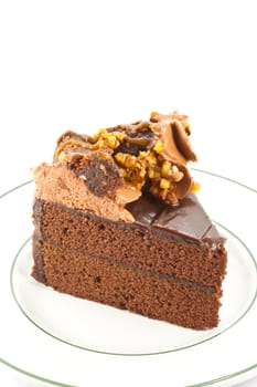 piece of chocolate cake on the white plate