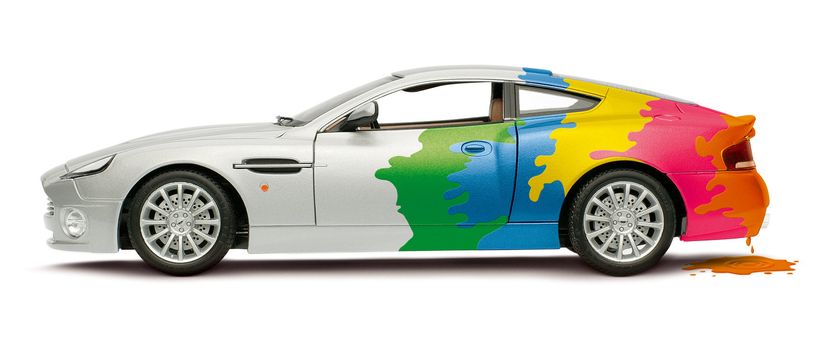 A colored car with dripping paint in the back