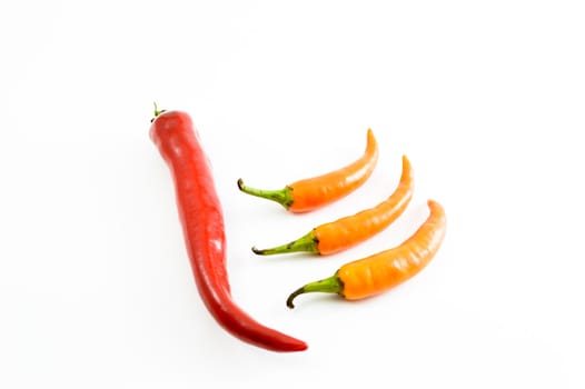 Yellow chili peppers isolated on a white background