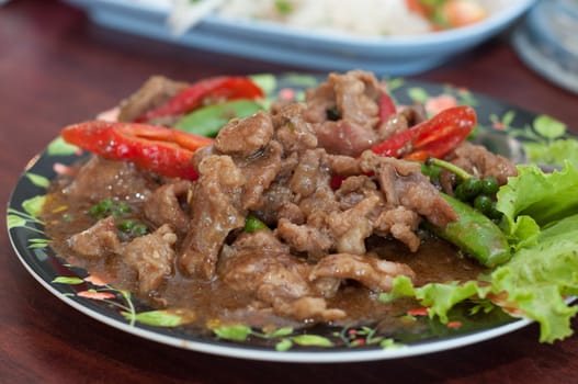 stir cow meat on dish