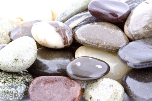 Wet pebble stones natural background. Close-up