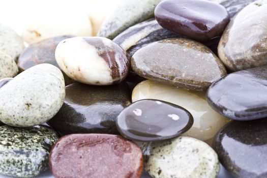 Wet pebble stones natural background. Close-up