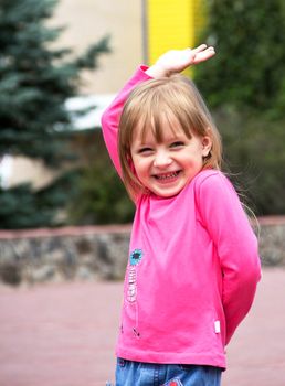 Cute smiling little girl posing. Close up