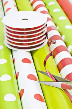 Rolls of gift wrapping paper and rolls of ribbon