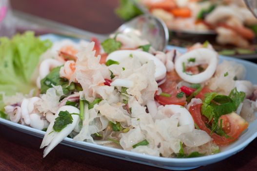 mix white mushroom with sea food on dish