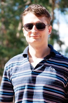 A man in sunglasses outdoors