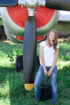 beautiful girl on the background plane survey at the Museum