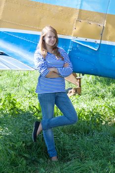 beautiful girl on the background plane survey at the Museum