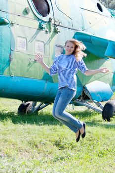 beautiful girl on the background plane survey at the Museum