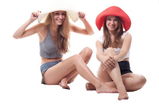 Two girls in summer hats studio photography