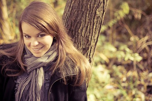 The girl next autumn trees outdoors shooting