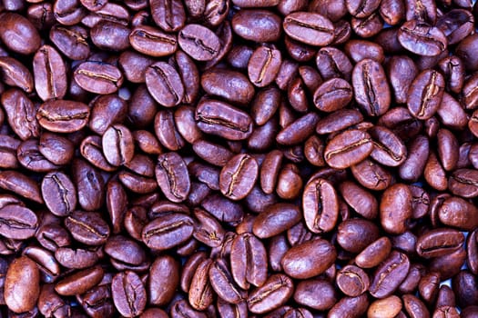 Roasted coffee beans texture. Food background. Close up