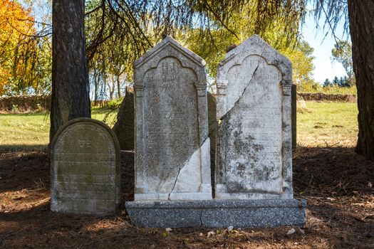 forgotten and unkempt Jewish cemetery with the strangers