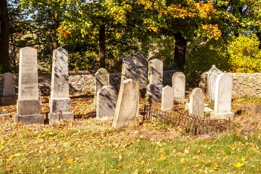 forgotten and unkempt Jewish cemetery with the strangers