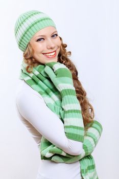 Young pretty woman in warm winter hat and scarf